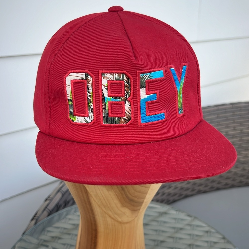 OBEY vintage flat bill hat. Red with tropical letters.
